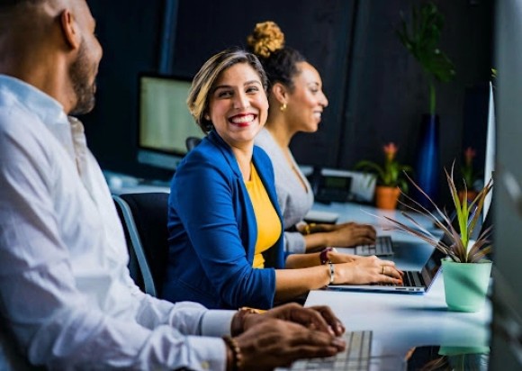 Co-workers using tools and software for their team